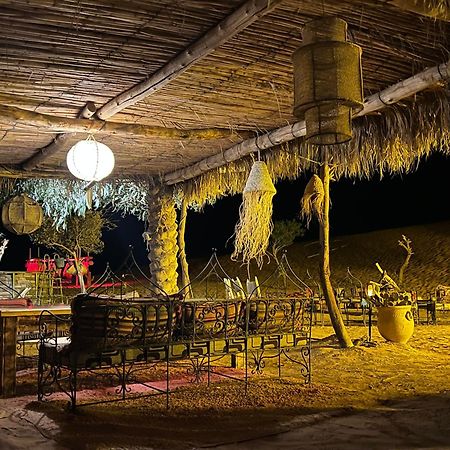 Sahara Majestic Luxury Camp Hotell Merzouga Exteriör bild The interior of a desert camp