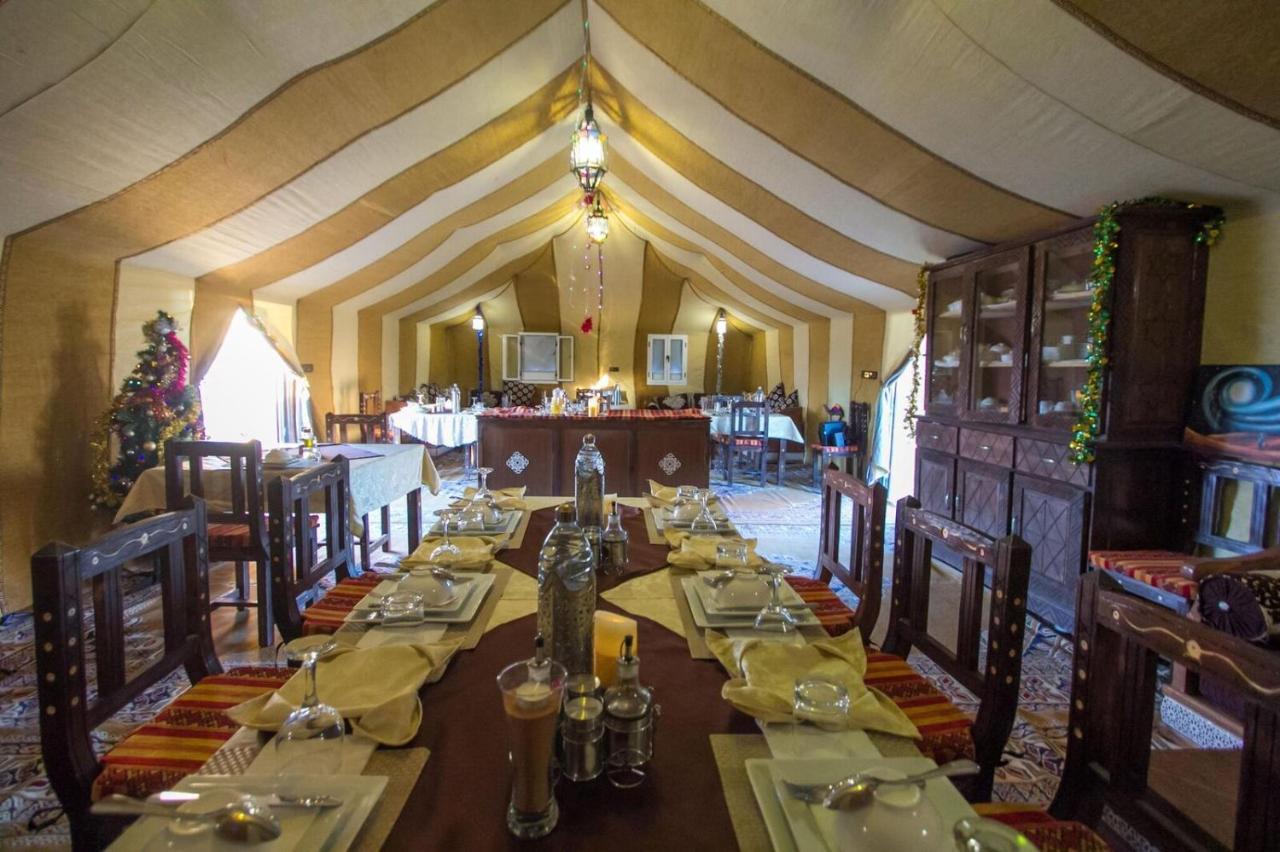 Sahara Majestic Luxury Camp Hotell Merzouga Exteriör bild The interior of a tent at the resort